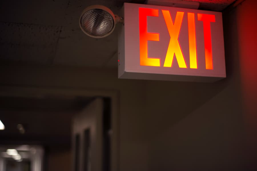 A glowing red exit sign