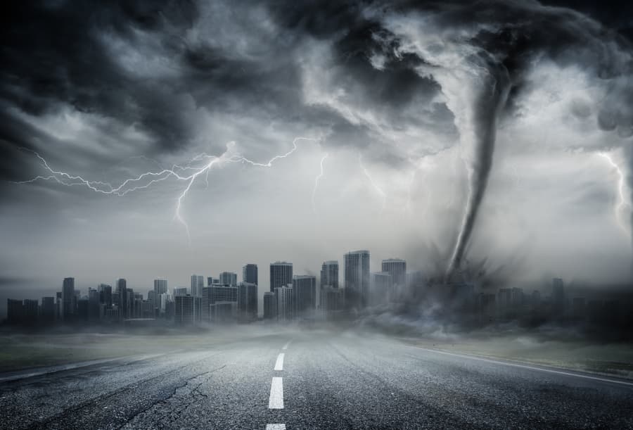 An illustration of a tornado bearing down on a city