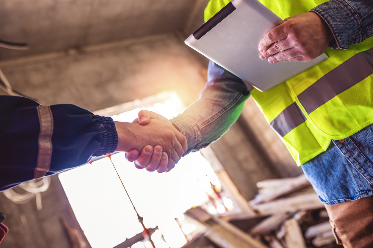 Shaking hands with contractor for project contract