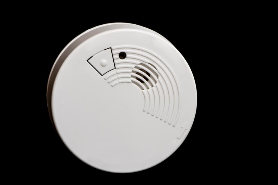 Smoke Detector Hanging On A Home Wall