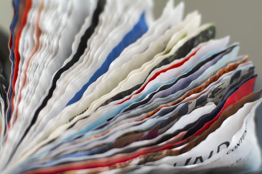 Stack of wet papers from flood that need drying